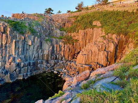 The Sea of Japan and cliffs seen from Tojinbo in Fukui Prefecture in the evening, tojiban, coastal, irie, JPG