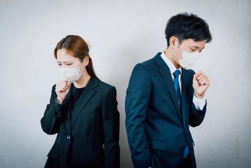 風邪を引いて咳をしている男女　マスク 風邪,体調不良,男女の写真素材