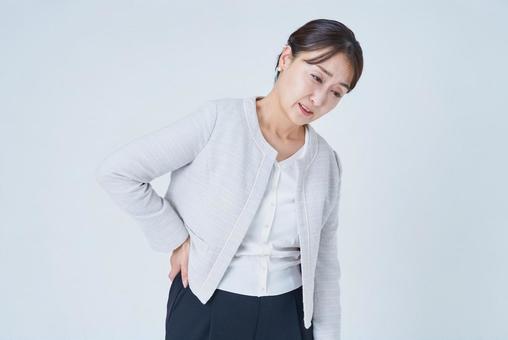 腰痛に苦しむビジネスウーマン 腰痛に苦しむビジネスウーマン 腰痛,女性,ビジネスウーマンの写真素材