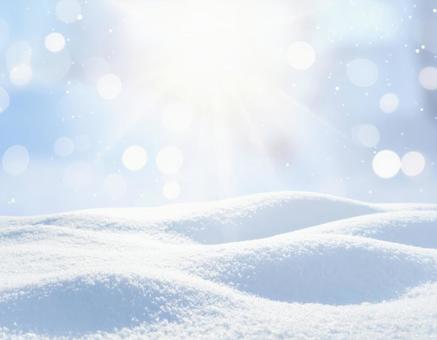 雪と光のボケが輝く冬の幻想的背景 雪と光のボケが輝く冬の幻想的背景の写真