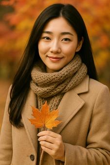 落ち葉を持つ女性のポートレート 秋 落ち葉を持つ女性のポートレート 秋の写真