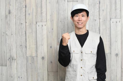 Asian male worker wearing helmet and work clothes, JPG
