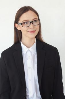 微笑み見つめるメガネの女性 女性,外国人,ビジネスの写真素材