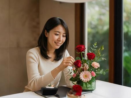 フラワーアレンジメントする女性 フラワーアレンジメントする女性の写真