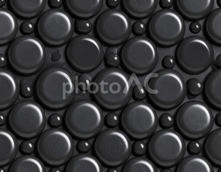 黒いワックスの石と水滴模様 ワックス,黒,石の写真素材