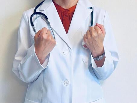 両手でガッツポーズをする女医 ガッツポーズ,女医,女性の写真素材