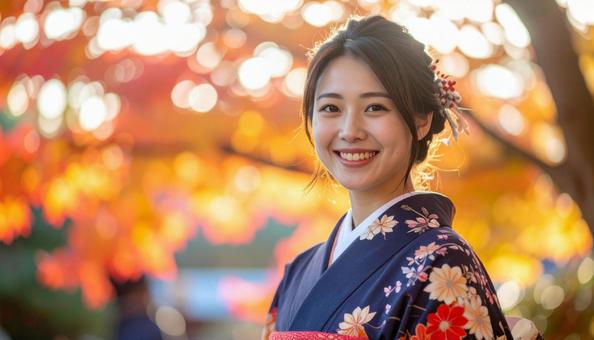 紅葉を眺める晴れ着姿の女性のポートレートの写真