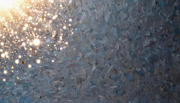 光の粒子が広がる青い抽象背景の写真