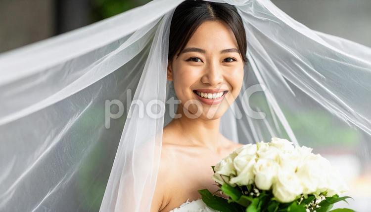 ベールとウエディング姿の花嫁　ブーケ 花嫁,ウェディング,ウェディングドレスの写真素材