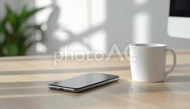 テーブルのコーヒーとスマホ テーブル,カップ,影の写真素材