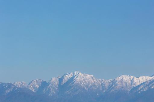 青空スペース｜雪の立山連峰｜剱岳 青空,雪山,山の写真素材
