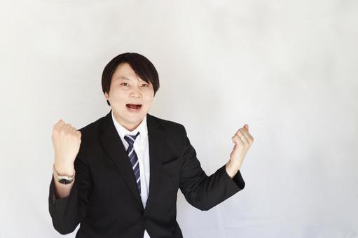 喜びのガッツポーズ男性 ビジネスマン,男性,ガッツポーズの写真素材