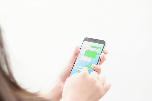 Image of a woman operating a smartphone Image of a woman operating a smartphone