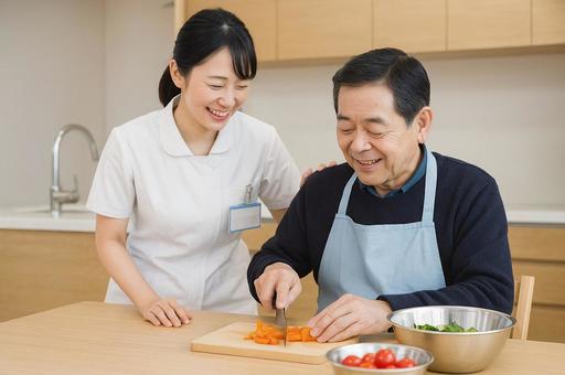 料理療法をする男性と作業療法士 料理療法をする男性と作業療法士の写真
