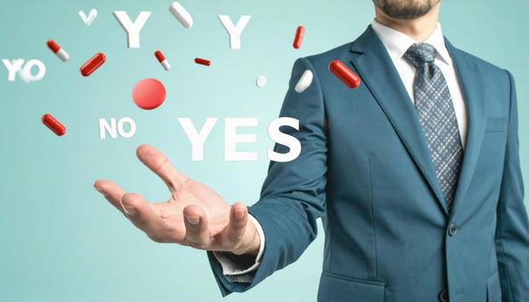 空中に浮かぶ「YES」を選ぶビジネスマン 空中に浮かぶ「YES」を選ぶビジネスマンの写真