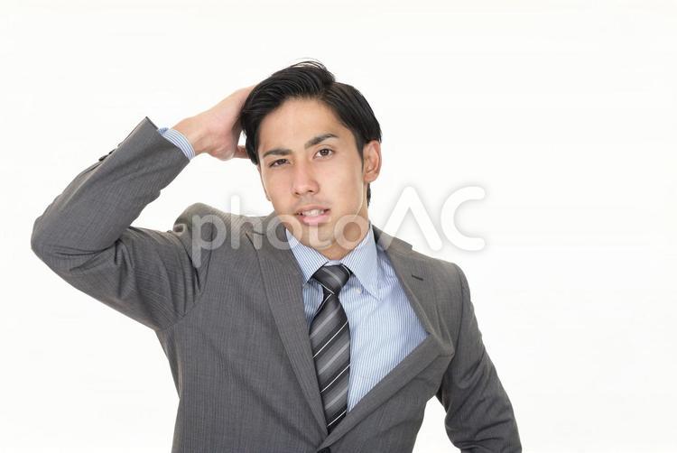 困った表情の男性 男性,仕事,困るの写真素材