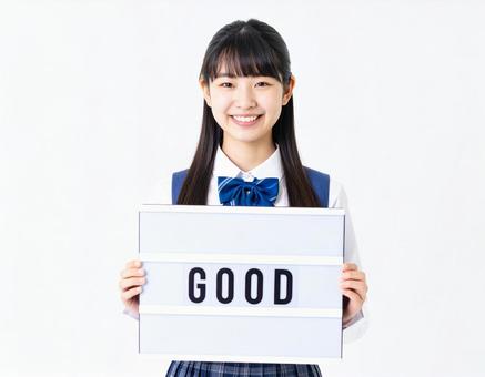 Goodと書いたボードを持つ女子生徒 Goodと書いたボードを持つ女子生徒の写真