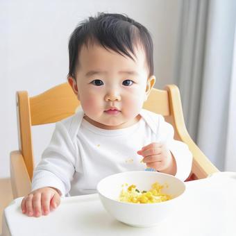 食事中の赤ちゃん AI生成画像   食事中の赤ちゃん AI生成画像  の写真