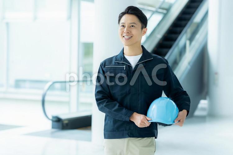 作業服を着たビジネスマン 作業服,笑顔,ビジネスマンの写真素材