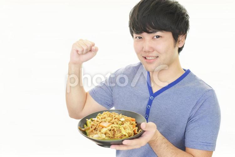 食事を楽しむ男性 男性,食事,料理の写真素材