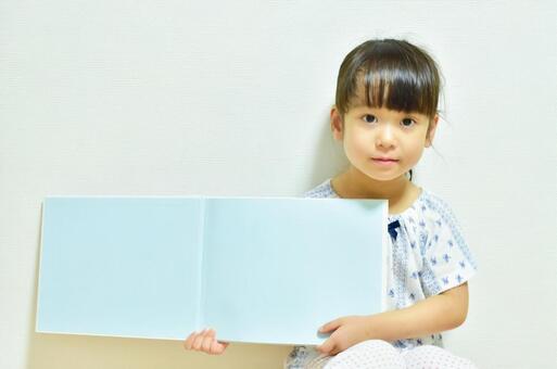 Girl showing a picture book spread 1 Summer, children, texture, picture book, JPG