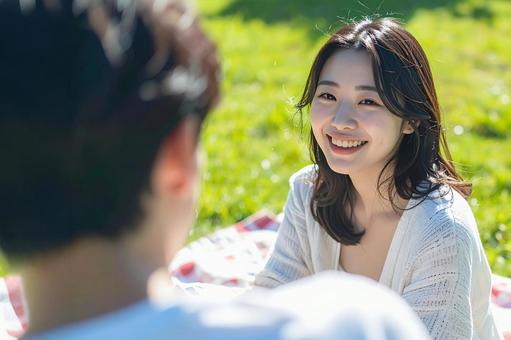 ピクニックを楽しむ女性の写真