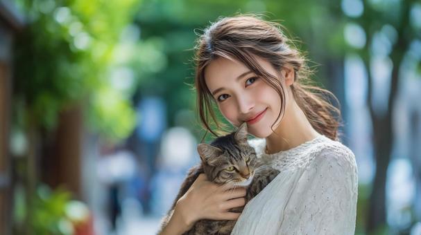 猫を抱く女性 猫を抱く女性の写真