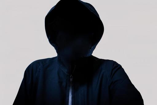 フードをかぶった人物のシルエット フードをかぶった人物のシルエット フード,男性,闇の写真素材