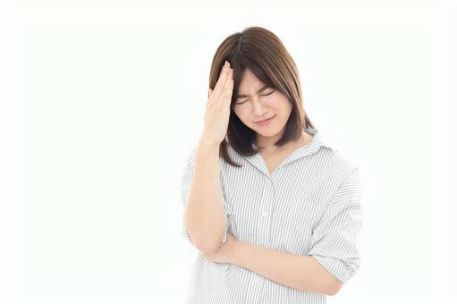 若い女性 ネガティブイメージ 頭痛 若い女性 ネガティブイメージ 頭痛 女性,人物,頭痛の写真素材