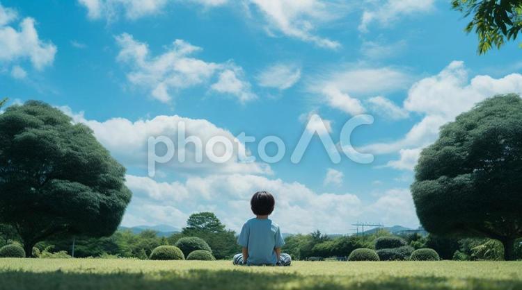 芝生に座る子供 山,自然,風景の写真素材