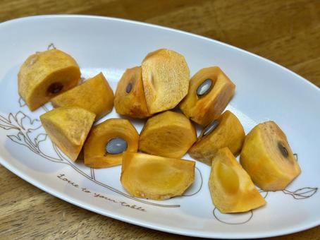 切った柿 甘い食べ物,フルーツ,オレンジの写真素材