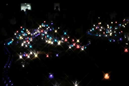 夜の闇に浮かぶ幻想的な光のボケ キャンドル,キャンドルナイト,ろうそくの写真素材