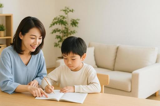 リビング学習する小学生とサポートする母親 リビング学習する小学生とサポートする母親の写真