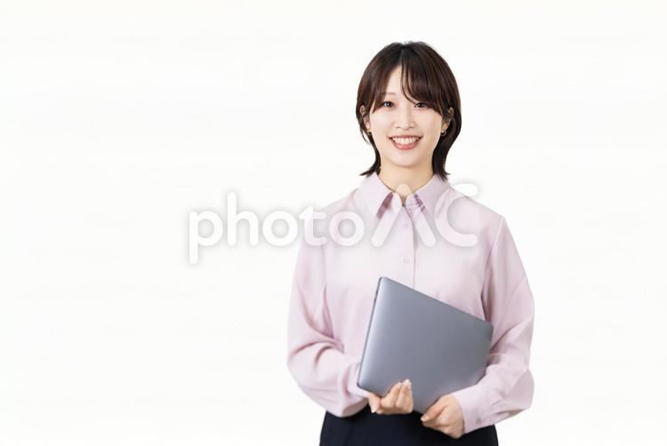 ノートパソコンを持つ女性ビジネスマン 女性,ビジネス,人物の写真素材