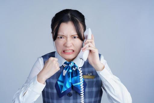 クレーム受付青いリボンの制服の女性 女性,電話,怒るの写真素材