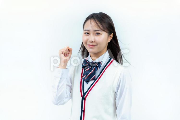 ガッツポーズをする学生 女子高生,笑顔,高校生の写真素材