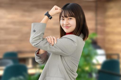 ガッツポーズをする女性・ビジネスウーマン 女性,ガッツポーズ,笑顔の写真素材