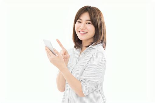 若い女性 スマートフォン 若い女性 スマートフォンの写真