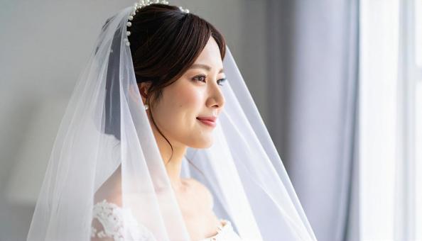ベールをまとう花嫁の写真