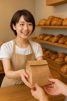 パン屋さんで働く素敵な女性 パン屋さんで働く素敵な女性の写真