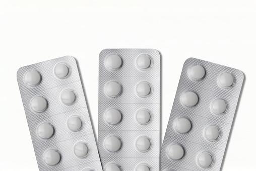 複数枚並んだ未開封の白い錠剤シート 複数枚並んだ未開封の白い錠剤シート 錠剤,薬,クスリの写真素材