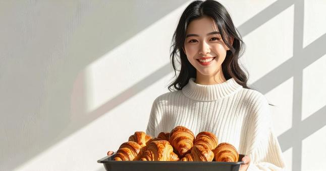 クロワッサンと女性 クロワッサンと女性の写真