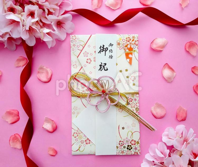 お祝い袋と桜とリボン5 結婚祝い,御祝,祝儀袋の写真素材