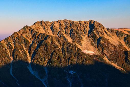 朝焼けの北アルプスの立山 立山,立山黒部アルペンルート,立山連峰の写真素材