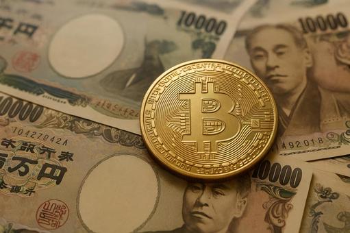 紙幣とビットコイン 紙幣とビットコインの写真