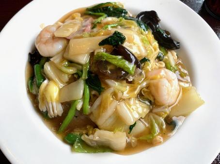 Fried noodles with thickened sauce served on a white plate, JPG Fried noodles with thickened sauce served on a white plate, JPG