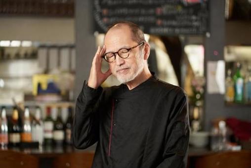 Asian man worried at a restaurant Asian man worried at a restaurant