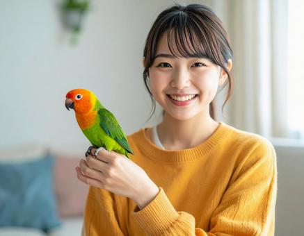 手乗りボタンインコと彼女 手乗りボタンインコと彼女の写真