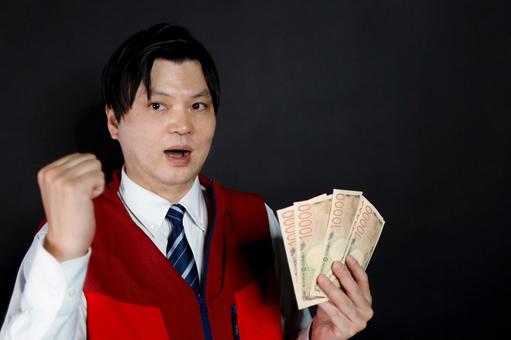 現金を持つ男性の喜び 現金を持つ男性の喜びの写真