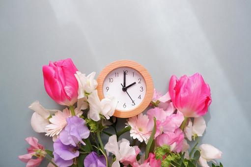 Spring time, desk clock and flower decoration background, JPG